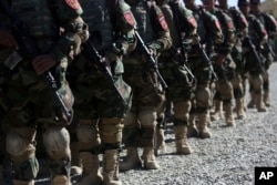 New members of the Afghan Special forces attend their graduation ceremony at the Afghan Corp, on the outskirts of Kabul, Afghanistan, Oct. 25, 2017.