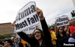 Protesters call for the removal of South Africa's President Jacob Zuma as the country commemorates the anniversary the country's first democratic elections in Cape Town, April 27, 2016.