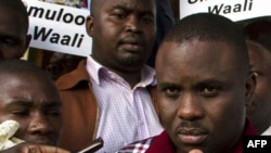 FILE - Kampala Lord Mayor Erias Lukwago (R) address the media outside the Buganda Magistrates court, Uganda.