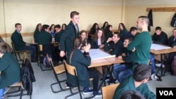 Skender Perteshi with the KCSS speaks to students about threat posed by extremists, outside Pristina, Kosovo. (J. Swicord/VOA)