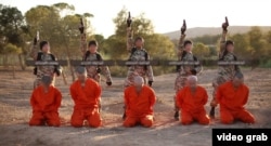 A screenshot from an undated Islamic State propaganda video purports to show young boys executing captured enemy fighters.
