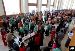 Myanmar lawmakers gather after a regular session of the lower house of parliament, Feb 1, 2016, in Naypyitaw, Myanmar, Feb. 1, 2016.