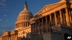 FILE - The morning sun illuminates the U.S. Capitol in Washington, Sept. 30, 2013. House Republicans unveiled a spending bill Saturday that would keep federal agencies funded through Sept. 30.