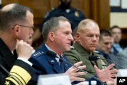 Air Force Chief of Staff Gen. David L. Goldfein, flanked by Marine Corps Commandant Gen. Robert B. Neller, right, testifies on Capitol Hill in Washington, April 5, 2017.