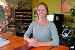 FILE - Jessica Shook poses for a photo at the winery where she works in Salida, Colo., April 30, 2018.