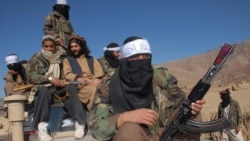 FILE - Pakistan's Taliban commander Latif Mehsud (C), a close aide to the former chief of the Tehreek-e-Taliban Pakistan (TTP), Hakimullah Mehsud, sits on a vehicle in in Khyber Pakhtunkhwa province, Nov. 26, 2008.