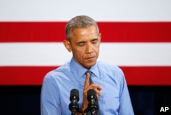 President Barack Obama pauses while speaking about the Flint, Michigan, water crisis, Jan. 20, 2016, at the United Auto Workers-General Motors Center for Human Resources in Detroit.