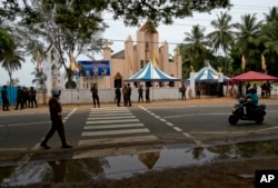 Soldiers guard outside St. Joseph's church in Thannamunai, Sri Lanka, April 30, 2019.