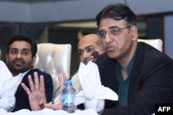 Pakistan's Finance Minister Asad Umar speaks during a visit to the Karachi Stock Exchange in Karachi on Oct. 20, 2018.