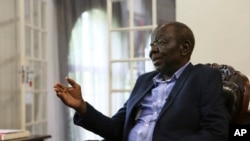 FILE - Zimbabwe's main opposition leader Morgan Tsvangirai stresses a point during an interview with the Associated Press at his home in Harare.