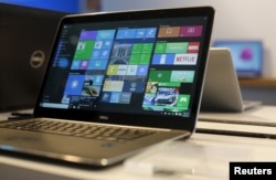 FILE - A laptop computer featuring Windows 10.