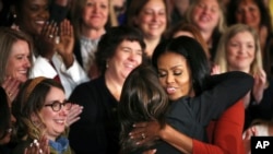First lady Michelle Obama hugs 2017 School Counselor of the Year Terri Tchorzynski, after her final speech as First Lady at the 2017 School Counselor of the Year ceremony in the East Room of the White House in Washington, Jan. 6, 2017.