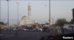 General view of security personnel in front of a mosque as police stage a second controlled explosion, after a suicide bomber was killed and two other people wounded in a blast near the U.S. consulate in Jeddah, Saudi Arabia, July 4, 2016.