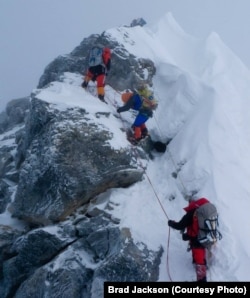 Alison Levine (in blue) on her way up Mount Everest.