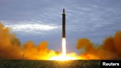 A missile is launched during a long and medium-range ballistic rocket launch drill in this undated photo released by North Korea's Korean Central News Agency in Pyongyang on Aug. 30, 2017.