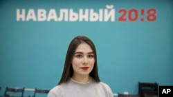 Russian opposition leader Alexei Navalny supporter Ekaterina Osovskaya, 18, poses for a photo in Moscow, Russia, March 2, 2018. Vladimir Putin's legacy depends not only on winning re-election Sunday but also on ensuring that today's first-time voters stay loyal to his vision. Nationwide, young people are among his most ardent supporters, but some twenty-somethings who have only known Putin as their leader are frustrated by income equality, corruption and other problems under his all-powerful leadership.