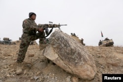 The Afghan National Army prepare for an operation against insurgents in Khogyani district of Nangarhar province, Afghanistan Nov. 28, 2017.
