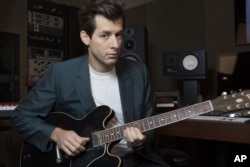 Mark Ronson poses for a photo at Jeff Bhasker Studio, in Venice, California.
