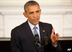 President Barack Obama gestures as he answers question from members of the media during a news conference.