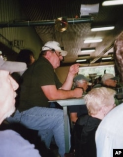 An auctioneer tries to draw the best price at a recent Crumpton auction.