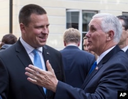 U.S. Vice President Mike Pence, right, and Estonia's Prime Minister Juri Ratas speak prior to their meeting at the Stenbocki house in Tallinn, Estonia, July 30, 2017.