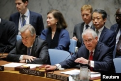 U.S. Secretary of State Rex Tillerson, right, speaks next to U.N. Secretary-General Antonio Guterres during a Security Council meeting on the situation in North Korea at the United Nations in New York, April 28, 2017.