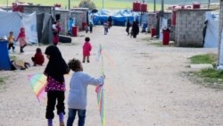 Children of foreign fighters play in the al-Roj camp in Syria, March 1, 2019. (H. Murdock/VOA)