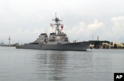 FILE - The guided missile destroyer USS Benfold arrives in port in Qingdao in eastern China's Shandong Province, Aug. 8, 2016.