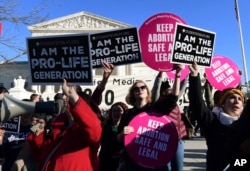 FILE - Protesters on both sides of the abortion issue are seen gathered outside the U.S. Supreme Court in Washington, Jan. 19, 2018.