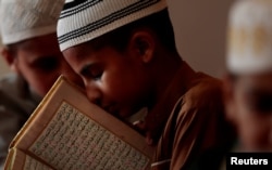 FILE - A student memorizes the Koran at a madrassa in Murree, Pakistan Sept. 27, 2017. Madrassas are often seen as breeding grounds for radicalism.