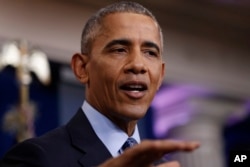 President Barack Obama answers questions from reporters at the White House, Jan. 18, 2017.