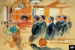 This courtroom sketch depicts Paul Manafort, fourth from right, standing with his lawyers in front of U.S. district Judge T.S. Ellis III, center rear, and the selected jury, seated left, during the jury selection of his trial in Alexandria.