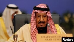 FILE - Saudi Arabia's King Salman attends a summit between Arab league and European Union member states, in the Red Sea resort of Sharm el-Sheikh, Egypt, Feb. 24, 2019.