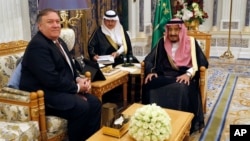 U.S. Secretary of State Mike Pompeo, left, meets with Saudi Arabia's King Salman in Riyadh, Saudi Arabia, Oct. 16, 2018.