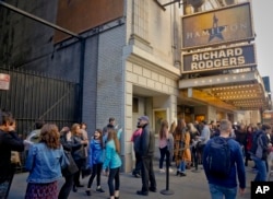 People line up to see the Broadway play "Hamilton," Nov. 19, 2016, in New York. President-elect Donald Trump demanded an apology from the cast of the hit musical a day after an actor lectured Vice President-elect Mike Pence about equality.