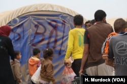 After registration, newly-arrived refugees are assigned tents. While they were only put up in the past few weeks, the desert dirt is already coating many of the tents in Khazir Camp in the Kurdish region of northern Iraq, Oct. 28, 2016.
