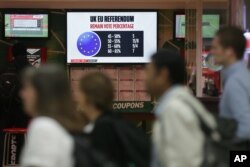 Betting odds for the the EU referendum result are displayed in a betting shop in Westminster, Thursday, June 23, 2016.