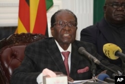 Zimbabwean President Robert Mugabe delivers a live speech to the nation, at State House, in Harare, Zimbabwe, Nov, 19, 2017. Mugabe baffled the country by ending his address without announcing his resignation.