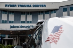 An emergency vehicle is parked at the entrance of Ryder Trauma Center where Haitian first lady Martine Moise was taken for treatment in Miami, July 7, 2021.