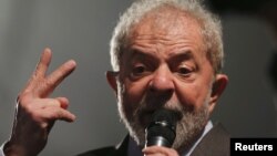FILE PHOTO - Former Brazilian President Luiz Inacio Lula da Silva speaks after giving testimony to federal judge Sergio Moro in Curitiba, Brazil, May 10, 2017. 