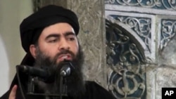 FILE - This image from video shows a man believed to be Abu Bakr al-Baghdadi, senior leader of the Islamic State militant group.