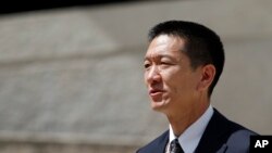 Hawaii Attorney General Douglas Chin speaks at a press conference outside the federal courthouse, March 15, 2107, in Honolulu. Chin sent at letter, signed by the attorneys general of 17 other states and the District of Columbia, seeking congressional prot