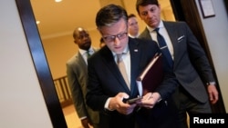 U.S. House of Representatives Speaker Mike Johnson arrives for a press conference ahead of a potential budget vote at the U.S. Capitol in Washington, March 11, 2025. 