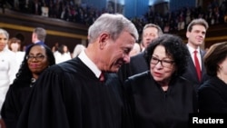 FILE - Chief Justice of the Supreme Court John Roberts chats with Associate Justice Sonia Sotomayor in the House of Representatives ahead of US President Joe Biden's third State of the Union address in the US Capitol in Washington, March 7, 2024. 
