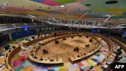 FILE - Leaders attend a roundtable meeting during a European Union summit at The European Council Building in Brussels, October, 21 2021. 