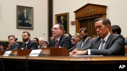 From left, Adam Cohen (Google), Matt Perault (Facebook), Nate Sutton (Amazon) and Kyle Andeer (Apple) listen to a question during a House Judiciary subcommittee hearing, July 16, 2019, on Capitol Hill in Washington. 