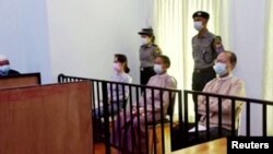 Myanmar's ousted leader Aung San Suu Kyi, former president Win Myint and doctor Myo Aung appear at a court in Naypyitaw, Myanmar May 24, 2021, in this still image taken from video. (MRTV/REUTERS TV/via REUTERS)