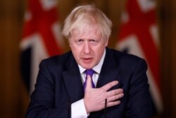 Britain&#39;s Prime Minister Boris Johnson speaks during a news conference on the ongoing situation with the coronavirus pandemic, at Downing Street in London, Wednesday December 2, 2020.