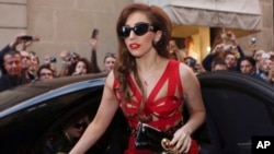 Lady Gaga arrives at the Versace atelier in Milan, Italy, Oct. 1, 2012. 