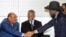 Sudan's President Omar Hassan al-Bashir (L) shakes hands with South Sudan's President Salva Kiir as African Union mediator and former South African leader Thabo Mbeki looks on. Bashir is due to pay his first visit to South Sudan since the two Sudans split.